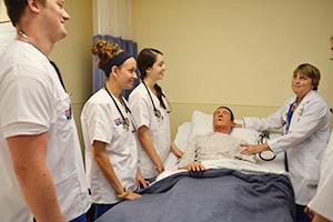 nursing students and teacher practicing